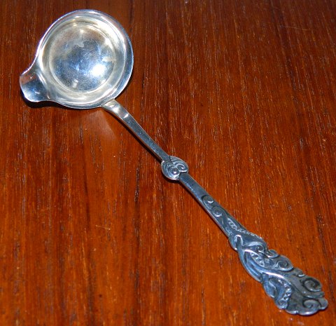 Cream spoon in seaweed pattern in silver
