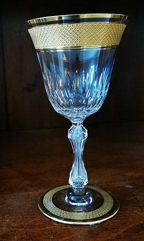 Crystal glass with cut-outs and gold decorations