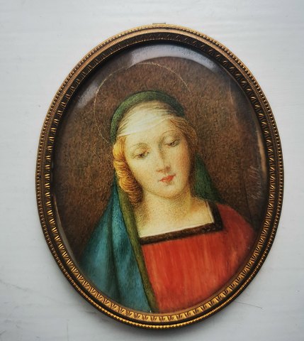 Miniature portrait of young beautiful girl in metal frame