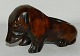 Dog figure in wood as pipe holder