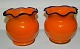 Pair of orange vases with blue wavy edge