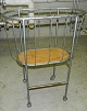 Infant metal cradle on wheels from around 1930