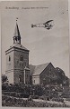 Postkort: Bregninge Kirke med flyveren i 1912