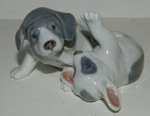 Royal Copenhagen figure in porcelain of playful puppies